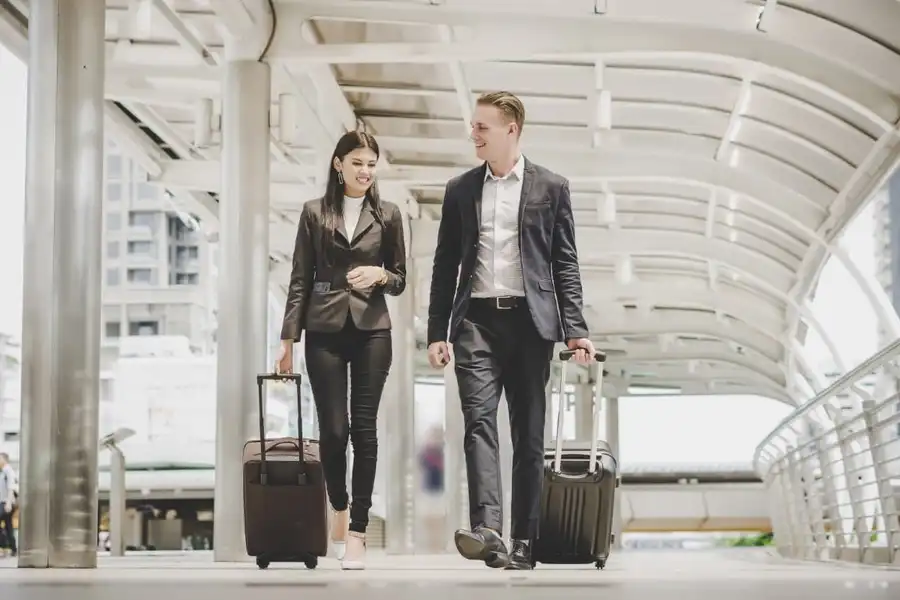 Minibus taxi at airport terminal with luggage for airport transfers